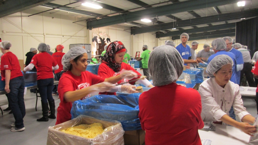 Helping means joy: Employees of WIKA USA packed food for children in famine regions.  